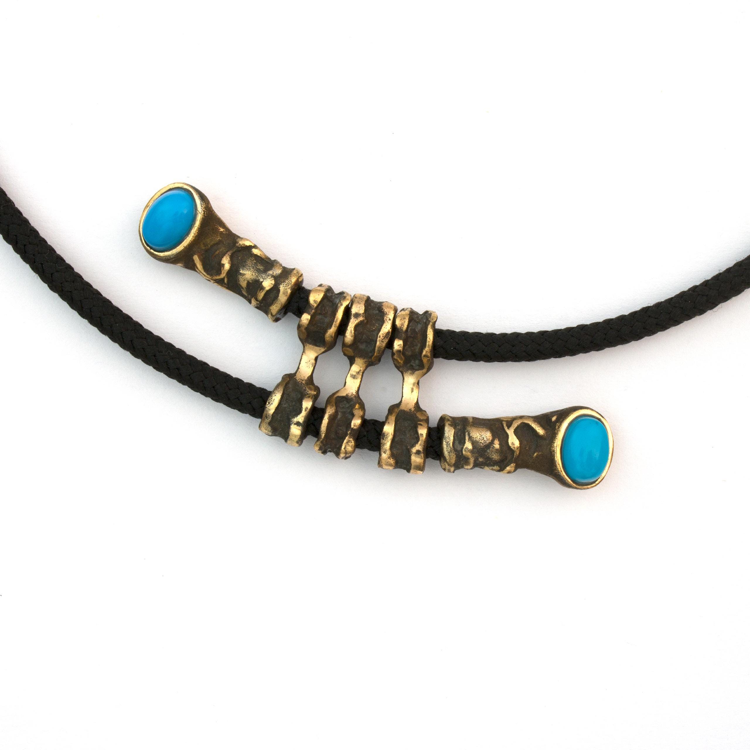 Bronze "Grid-style" necklace by Vojtěška Vlčková. Authorial jewel with turquenite cast using lost wax technique featuring geometric design. Worldwide shipping.